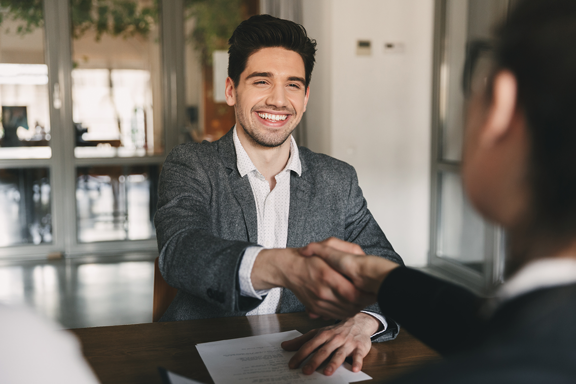 business-career-placement-concept-happy-caucasian-man-30s-rejoicing-shaking-hands-with-employee-when-was-recruited-during-interview-office | Botkeeper