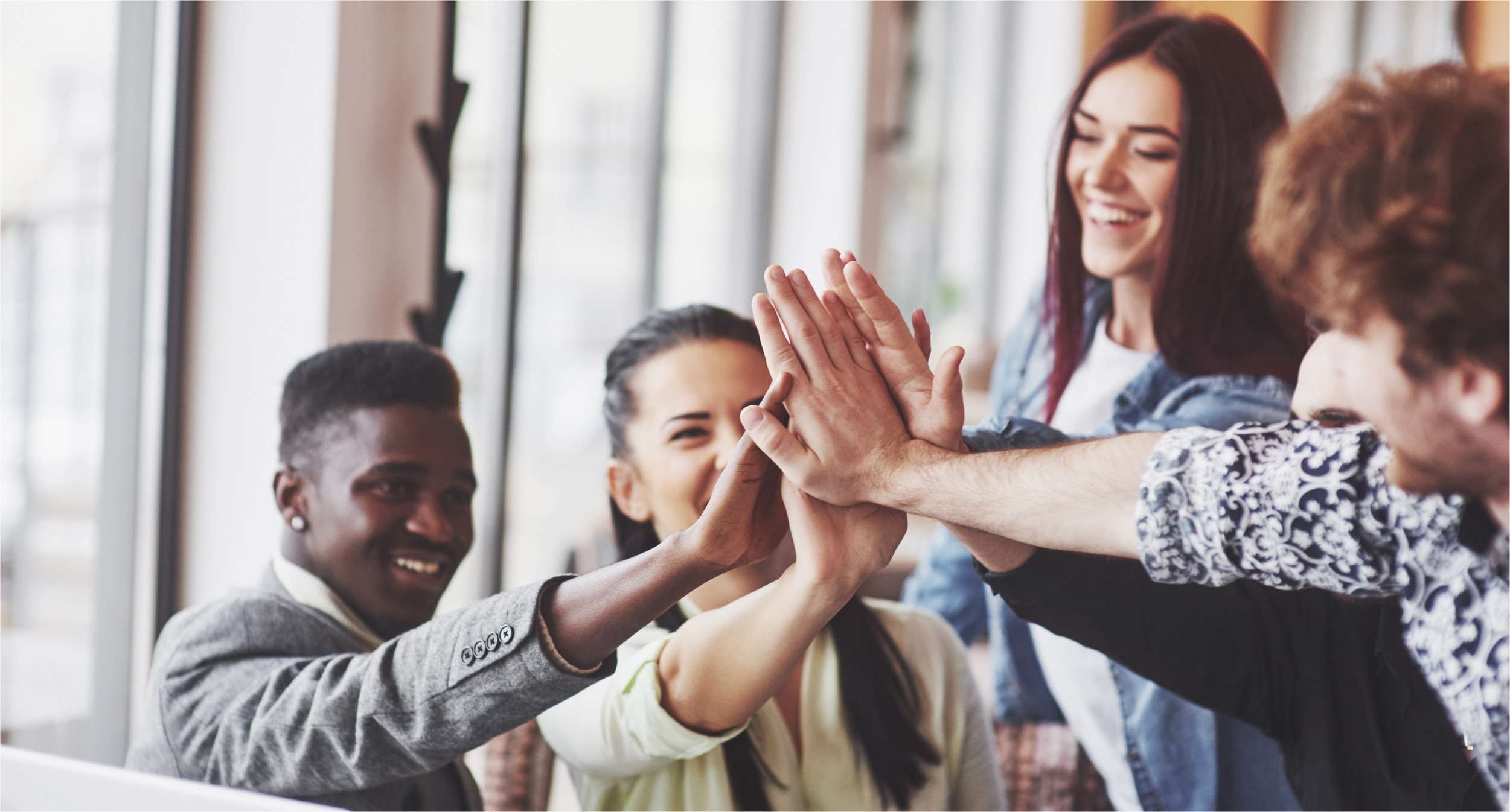 happy-young-entrepreneurs-casual-clothes-cafe-table-business-office-giving-high-fives-each-other-as-if-celebrating-success-starting-new-project-03