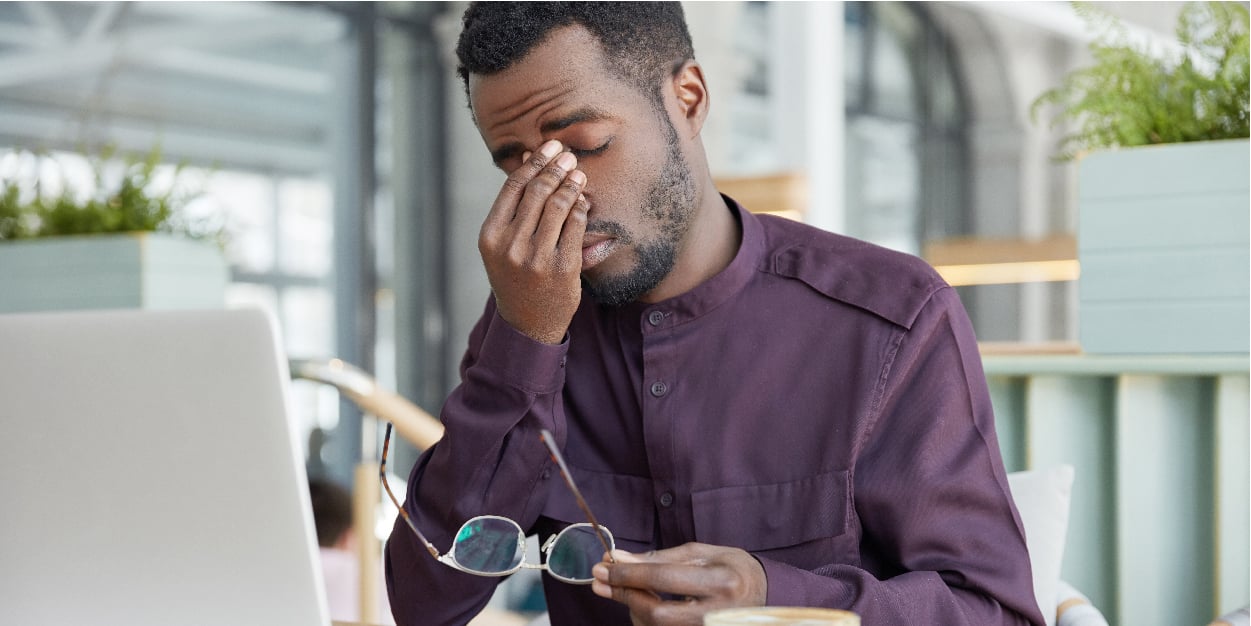 overworked-professional-male-economist-holds-spectacles-being-tired-work-laptop-computer-much-hours-has-headache-after-tired-working-day | Botkeeper